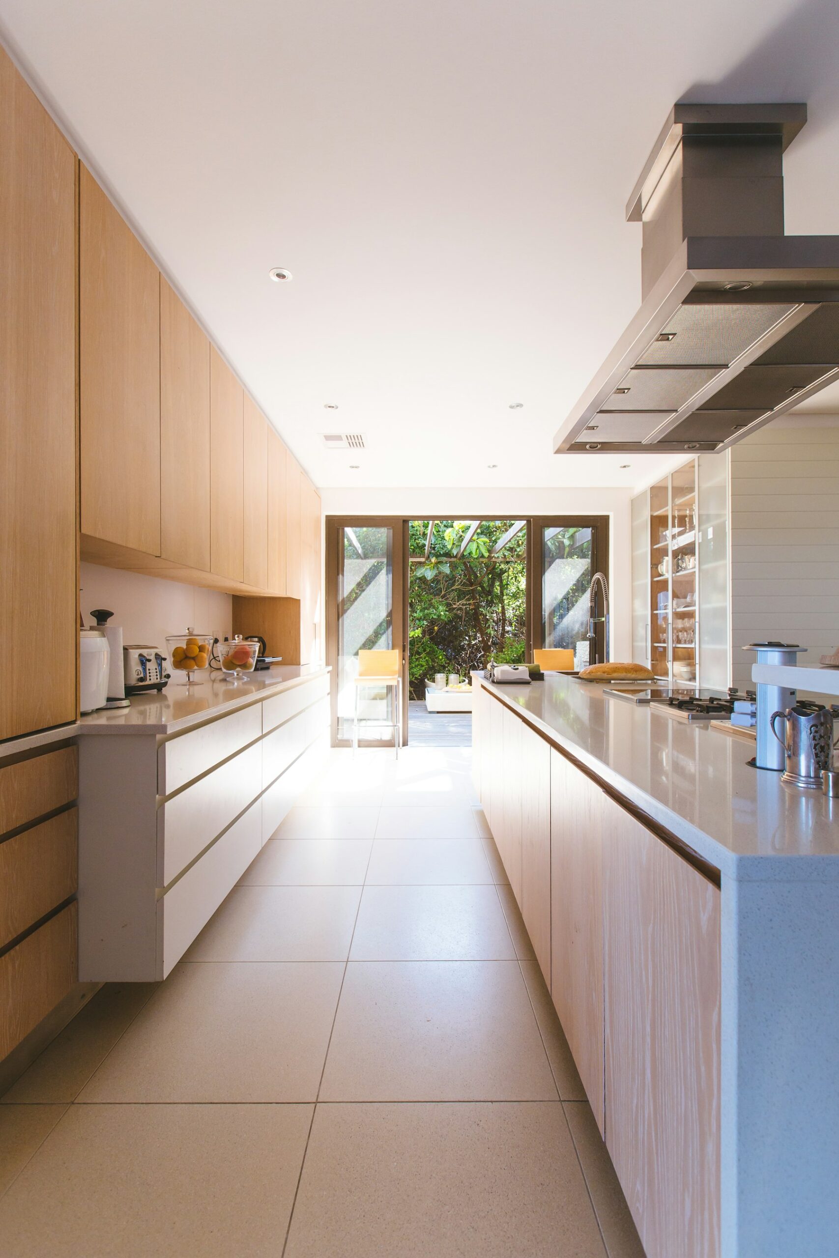 Bright kitchen extension with a long island and glazed end wall