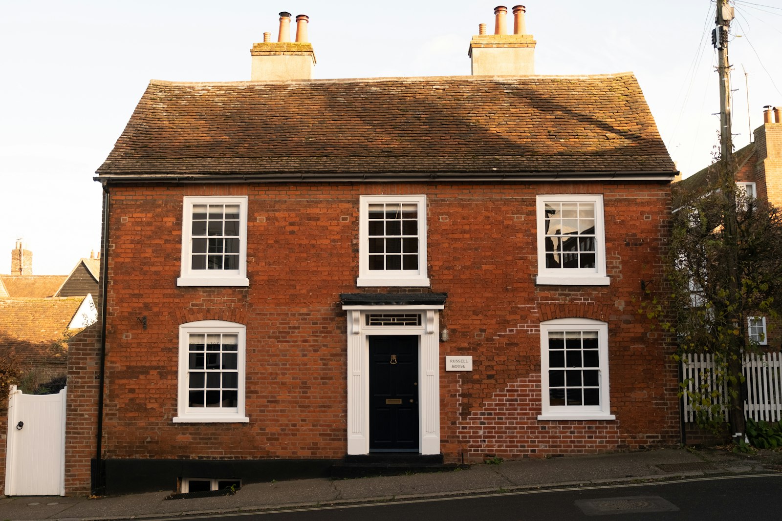 Red brick house with white windows