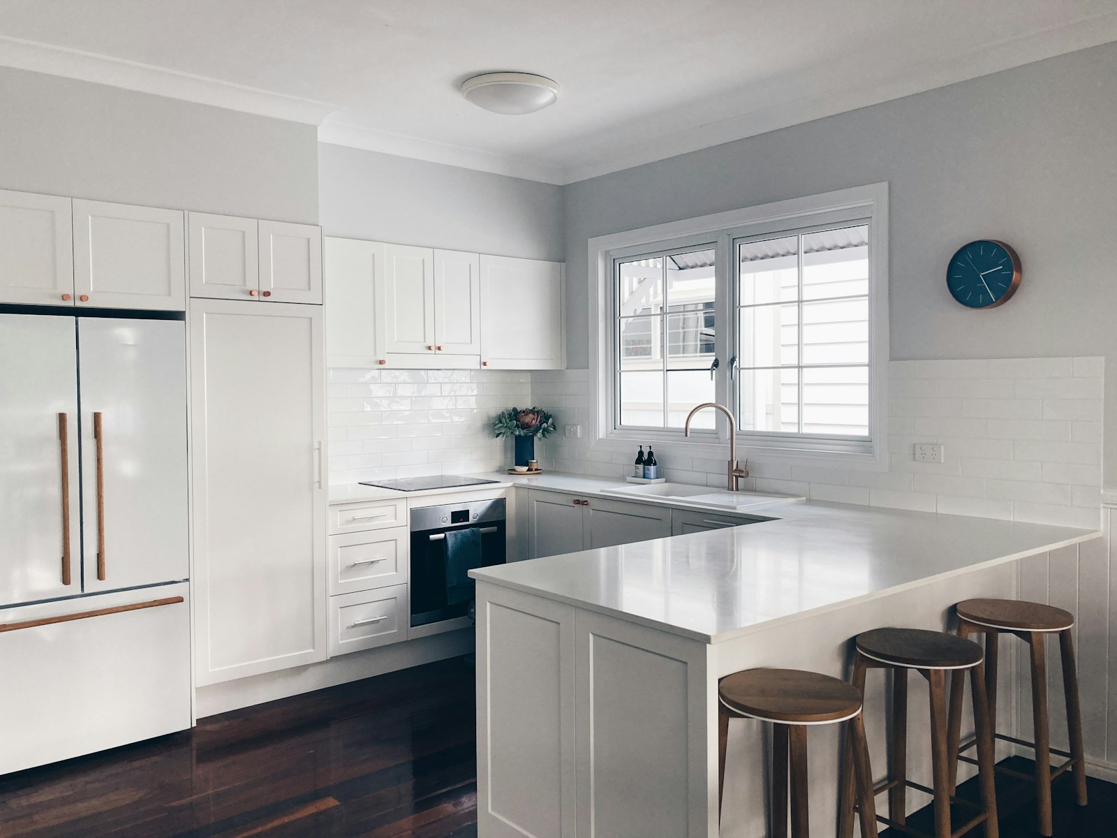 Bright white kitchen in a side return extension